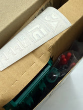 Carica l'immagine nel visualizzatore di Gallery, Close-up of the inside of the Kenner VROCS Blacklash Air Assault box showing contents and instruction sheet.
