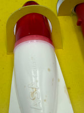 Carica l'immagine nel visualizzatore di Gallery, Close-up of the white and red rocket body showing fins and minor stains.
