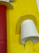 Carica l'immagine nel visualizzatore di Gallery, Detail view of the yellow, red, and white cup-shaped component.
