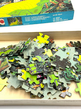Load image into Gallery viewer, Close-up detail of colorful puzzle pieces from the Disney Pete’s Dragon Puzzle.

