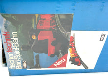Load image into Gallery viewer, Back view of Fischertechnik Bau-Spiel-Bahn Train Playset packaging with product information.
