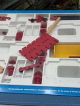 Load image into Gallery viewer, Close-up of Fischertechnik Bau-Spiel-Bahn Train Playset components featuring track and wooden pieces.
