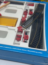 Load image into Gallery viewer, Detail view of Fischertechnik Bau-Spiel-Bahn Train Playset components including track pieces.

