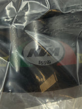 Load image into Gallery viewer, Close-up of a black patch with quilted texture and oval shape.
