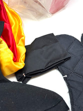 Load image into Gallery viewer, Ferrari Mazzini motocross costume detail close-up showing black gloves and layered clothing.
