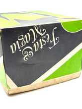 Load image into Gallery viewer, Angled view of the colorful motocross costume packaging box in green, black, and white.
