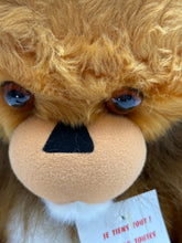 Load image into Gallery viewer, Detail close-up of Betsy Belle plush lion toy highlighting blue eyes and soft fur.
