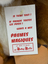 Load image into Gallery viewer, Detail of the tag attached to the Betsy Belle Lion plush.
