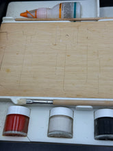 Carica l'immagine nel visualizzatore di Gallery, Detail view of three paint jars from the Prosolar kit on a wooden surface.
