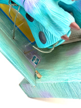 Carica l'immagine nel visualizzatore di Gallery, Detail shot of Sulley's foot with visible packaging.

