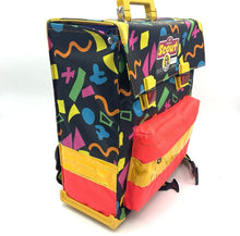 Load image into Gallery viewer, Close-up of the front pocket of the Scout backpack featuring zipper closure and text details.
