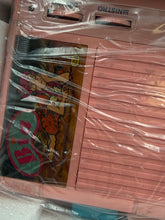 Load image into Gallery viewer, Detail of the pink device wrapped in plastic with visible cables
