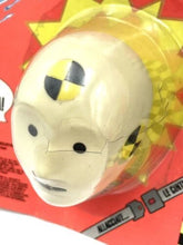 Carica l'immagine nel visualizzatore di Gallery, Detail close-up of Tyco Incredible Test Dummy featuring face design and safety symbol
