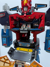 Load image into Gallery viewer, Detail view of the robot figure with articulated limbs and a detailed face.
