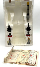 Load image into Gallery viewer, Detail close-up of various components and instruction sheet for Diaclone Robot Base.
