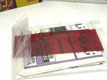 Carica l'immagine nel visualizzatore di Gallery, Transformers Bifronbot D-81 – close-up of bagged instructions and red decoder strip.
