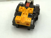 Load image into Gallery viewer, Transformers Argobot C-87 – rear view of drill vehicle mode highlighting connection points
