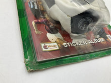 Load image into Gallery viewer, Side view of the Vintage Calcio Merlin sticker album highlighting the packaging and soccer design.
