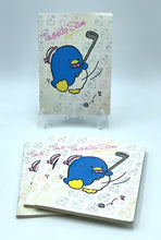 Carica l'immagine nel visualizzatore di Gallery, Front view of the 1985 Sanrio Tuxedosam notebook featuring a smiling character with a golf club.
