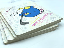 Carica l'immagine nel visualizzatore di Gallery, Close-up detail of the stacked notebooks featuring a cartoon character and lined pages.
