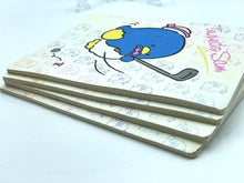 Carica l'immagine nel visualizzatore di Gallery, Side view of stacked notebooks displaying multiple layers with cartoon illustrations.
