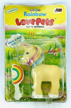 Carica l'immagine nel visualizzatore di Gallery, RARE 1984 Soma Rainbow Love Pet yellow unicorn toy in packaging with rainbow mane.
