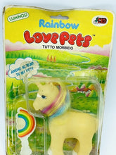 Carica l'immagine nel visualizzatore di Gallery, RARE 1984 Soma Rainbow Love Pet yellow unicorn toy in packaging with colorful graphics.
