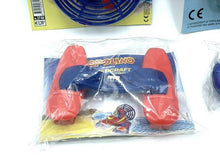 Carica l'immagine nel visualizzatore di Gallery, Close-up detail of red toy goggles in transparent packaging.
