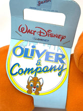 Carica l'immagine nel visualizzatore di Gallery, Detail shot of the plush dog tag featuring Disney branding and colorful design.
