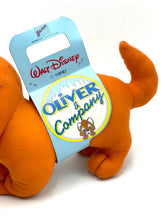Carica l'immagine nel visualizzatore di Gallery, Detail view of the orange dog toy with tag attached and soft material.
