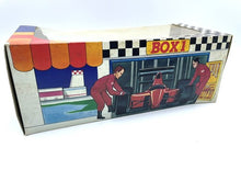 Carica l'immagine nel visualizzatore di Gallery, Decorative box view with checkered pattern and illustrative scenes.
