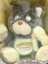 Carica l'immagine nel visualizzatore di Gallery, Close-up detail of the gray and white plush toy with a tag attached.
