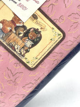 Carica l'immagine nel visualizzatore di Gallery, Detail close-up of the pink and blue bag showing textured surface and illustrated label.

