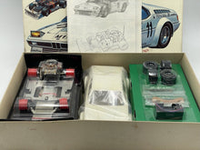 Load image into Gallery viewer, Close-up of Revell branding and model details on BMW M1 Turbo RC car packaging


