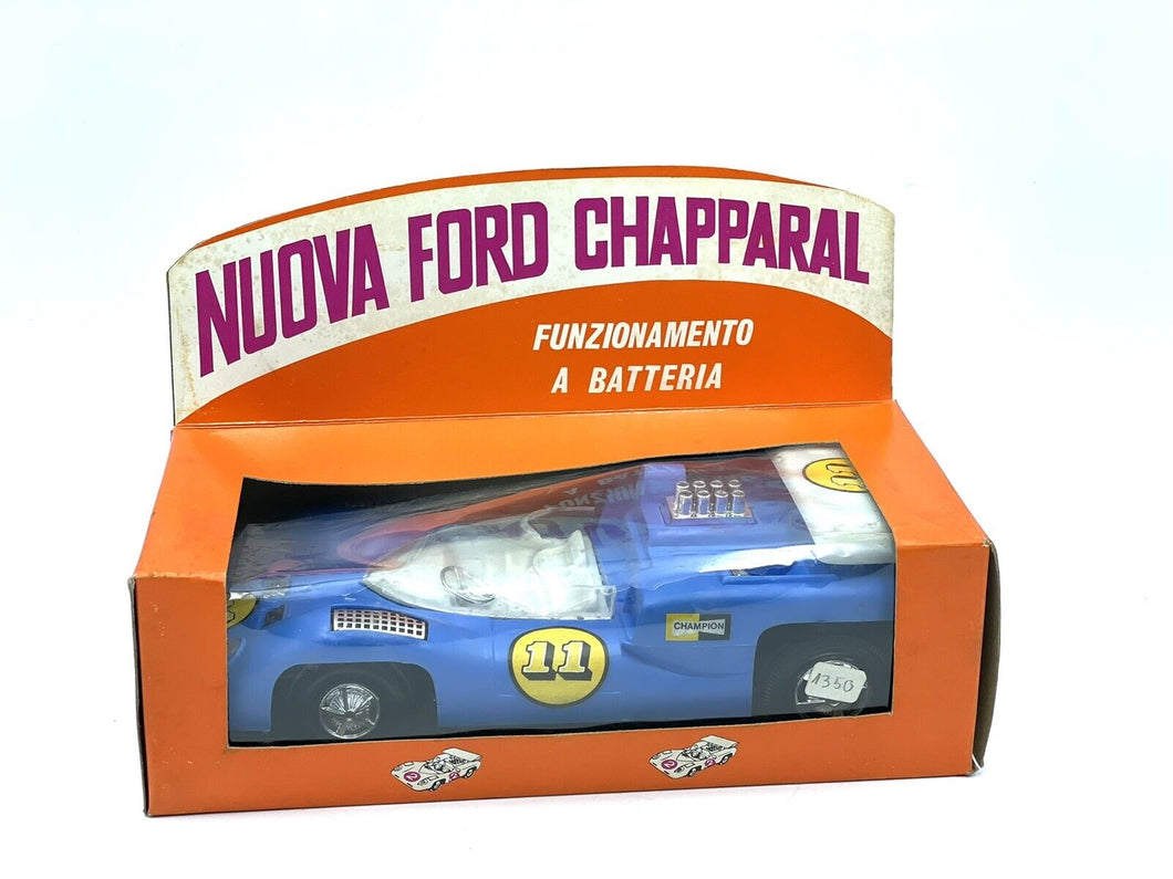 Front view of vintage battery-operated Chaparral 2F toy car in original box

