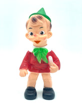 Load image into Gallery viewer, Ledraplastic Pinocchio rubber toy front view with a smiling face and pointy hat.
