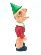 Load image into Gallery viewer, Ledraplastic Pinocchio rubber toy side profile highlighting the green collar and pointy hat.
