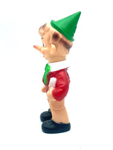 Load image into Gallery viewer, Ledraplastic Pinocchio rubber toy side view showcasing the pointy hat and green collar.
