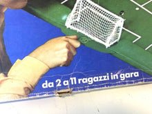 Load image into Gallery viewer, Detail of the game box with visible text and a hand pointing.
