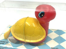 Load image into Gallery viewer, Close-up detail of the Bandai Wind-up Swimming and Walking Turtle in transparent packaging.
