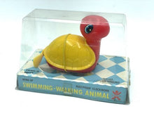 Load image into Gallery viewer, Bandai Wind-up Swimming and Walking Turtle packaging view with transparent cover and checkerboard base.
