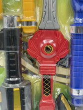 Load image into Gallery viewer, Close-up of various toy weapons in red, black, yellow, and blue colors.
