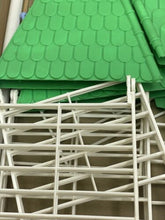 Load image into Gallery viewer, Close-up of green fabric with a textured pattern used in Pimea Chalet toy bird house.

