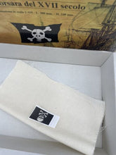 Load image into Gallery viewer, Lifestyle shot of a wooden model part held in hand with instruction sheet.
