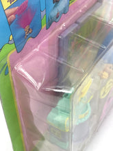 Load image into Gallery viewer, Close-up detail of Galoob Tiny Troll Town Flower Shop in transparent packaging.
