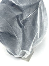 Load image into Gallery viewer, Close-up of gray fabric with a wrinkled texture against a white background.
