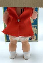 Load image into Gallery viewer, Back view of the 1967 Mattel Walk n Play doll in a red outfit with white shorts.

