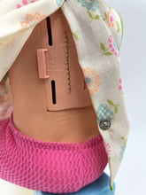 Load image into Gallery viewer, Back view of the Mattel Tippee Toes doll showing clothing detail and attachment slot.
