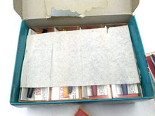 Load image into Gallery viewer, Walker Fly vintage fountain pen set showcasing empty packaging and various pens.
