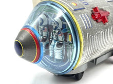 Load image into Gallery viewer, Detailed view of the vintage battery-operated space capsule toy showcasing text details and vibrant design.

